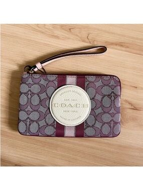 Coach Dempsey Large Corner Zip Wristlet In Signature
Jacquard With Stripe